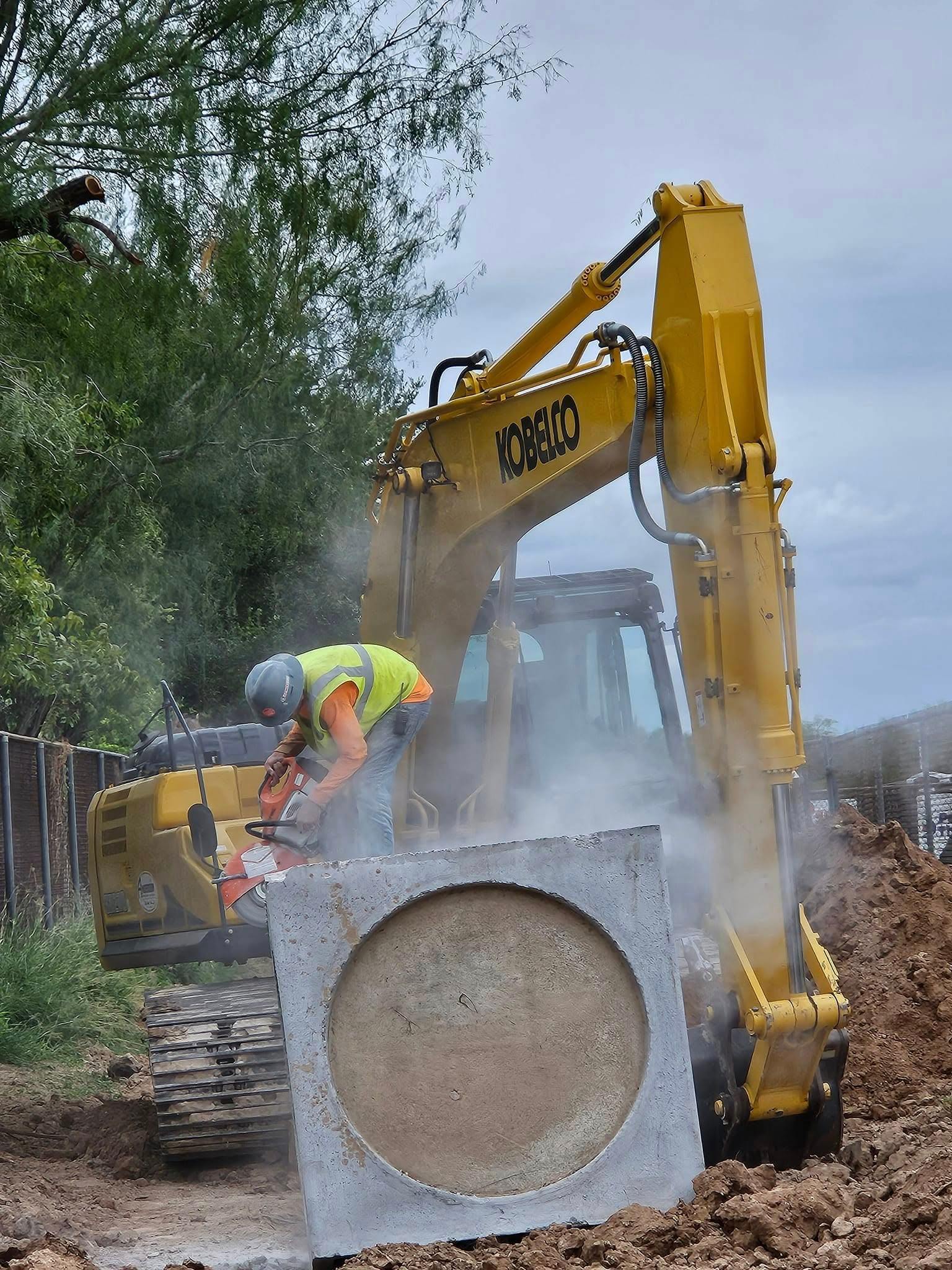 Diamond Eight crew cutting concrete inlet — Kobelco excavator